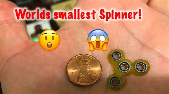 The longest fidget spinner spin ever + the world's smallest fidget spinner